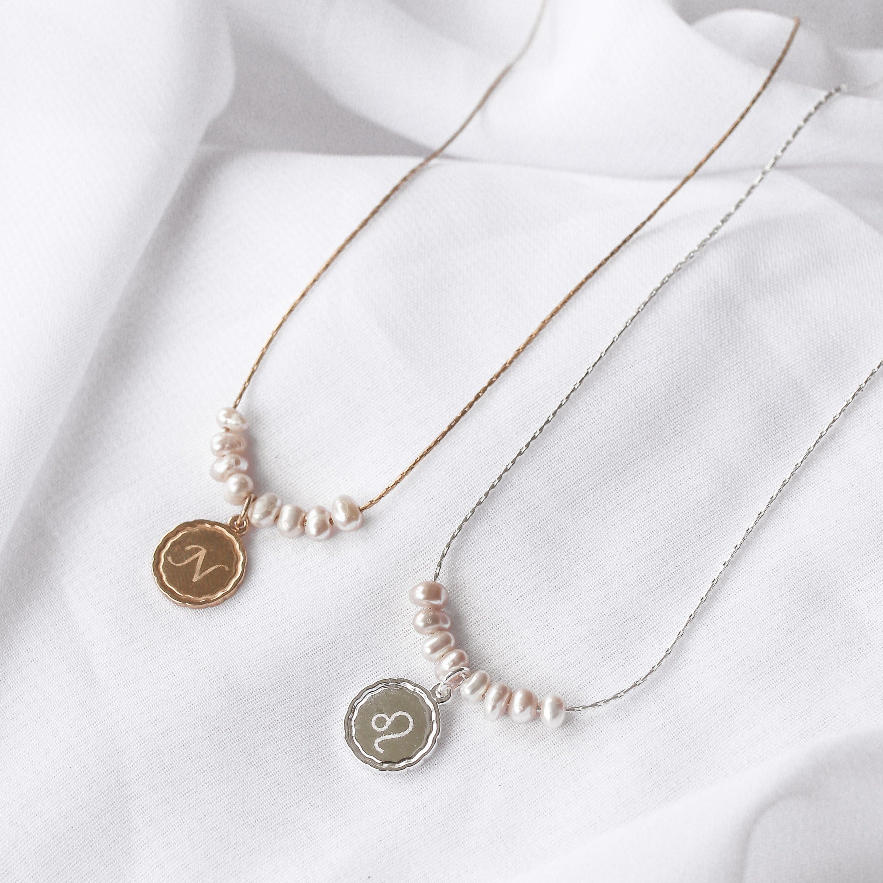 Pearl necklace with monogram pendant hotsell